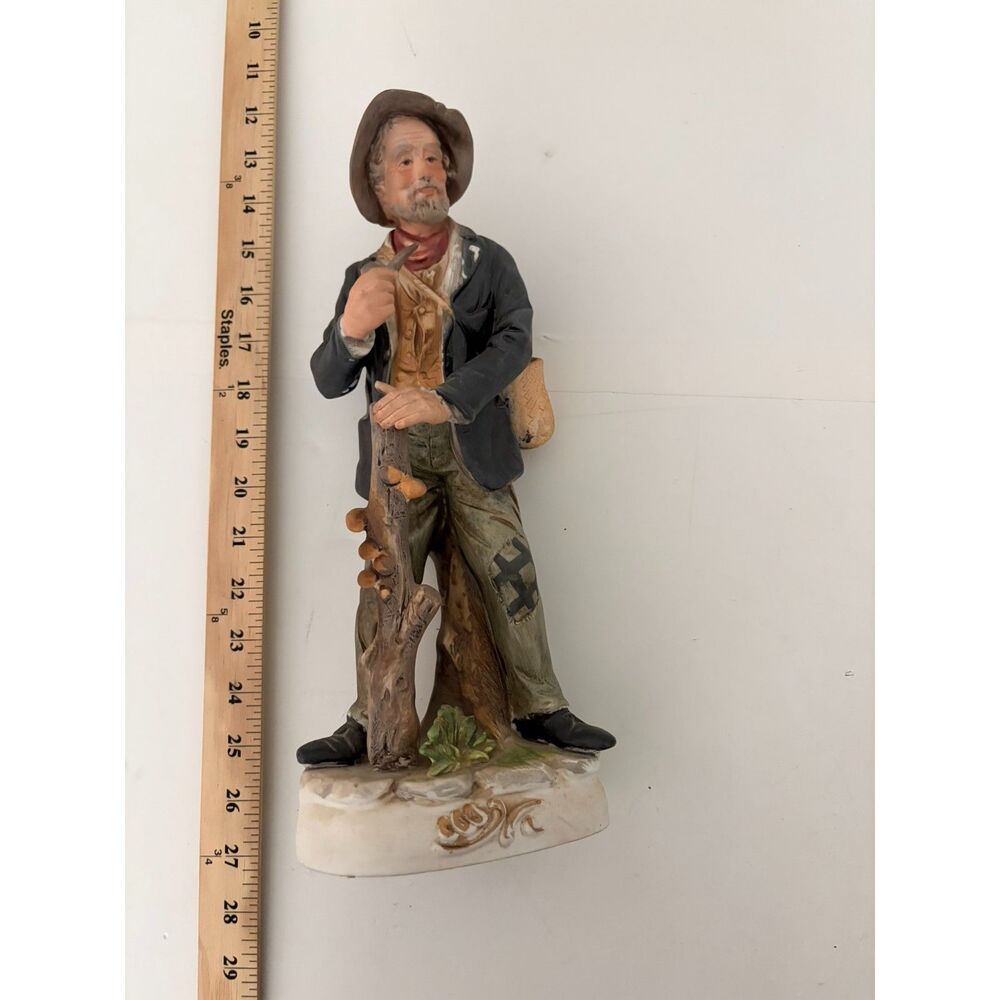 vtg. ardco 16" porcelain figurine of peasant man farmer with log